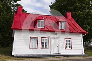 Ancestral house with red tin roof in Saint-Jean, Island of Orleans, Quebec