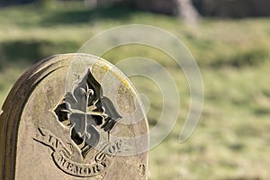 Ancestry and genealogy. Ancient gravestone inscribed with in memory of photo