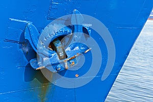 Anchor on blue ship in harbour