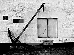 Anchor and building in Porthleven Cornwall UK