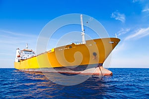 Anchor cargo yellow boat in blue sea