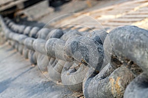 Anchor chain on ship deck. Close-up. Selective focus.