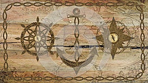 Anchor compass and ship steering wheel on wooden board