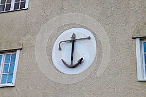Anchor decoration on side of a house
