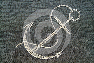 Anchor design in a cobbled sidewalk.