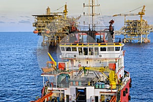 An anchor handling tug boat maneuvering at offshore oil field