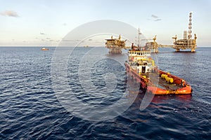 An anchor handling tug boat maneuvering at offshore oil field