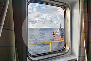 An anchor handling tug boat maneuvering at offshore oil field