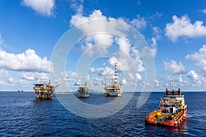 An anchor handling tug boat maneuvering at offshore oil field