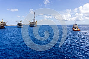 An anchor handling tug boat maneuvering at offshore oil field