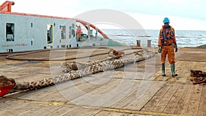 Anchor-handling tug supply AHTS vessel crew preparing vessel