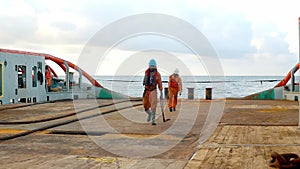 Anchor-handling tug supply AHTS vessel crew preparing vessel