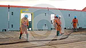 Anchor-handling tug supply AHTS vessel crew preparing vessel