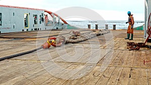 Anchor-handling Tug Supply AHTS vessel crew preparing vessel