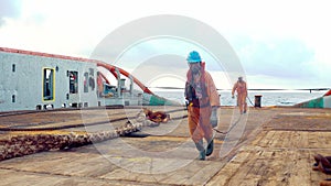 Anchor-handling Tug Supply AHTS vessel crew preparing vessel