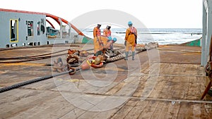 Anchor-handling Tug Supply AHTS vessel crew preparing vessel