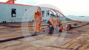 Anchor-handling Tug Supply AHTS vessel crew preparing vessel