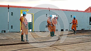 Anchor-handling tug supply AHTS vessel crew preparing vessel