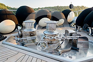 Anchor lowering and raising mechanism, Anchor Buoys and rigging on  the foredeck of a luxurious yacht