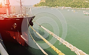 Anchor rope tied on cargo ship during moored alongside