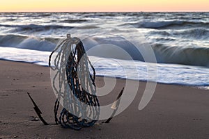 Anchor on the sandy shore of the Caribbean. Seascape at sunrise