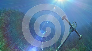 Anchor under water sun ray illustration