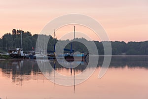 Anchorage of yachts on the lake at dawn