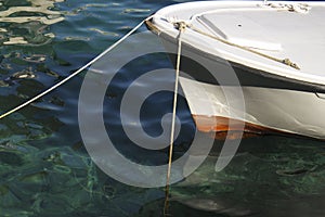 Anchored boat in shallow sea