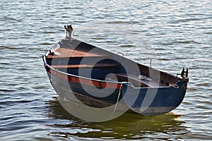 Anchored old rowboat