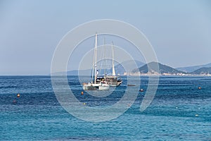 Anchored sailboats in waters of Tyrrhenian Sea