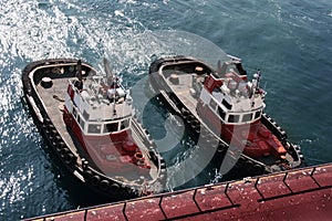 Anchored tugboats