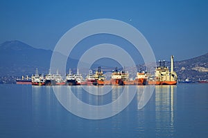 Anchored vessels side by side