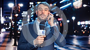 Anchorman Reporting Live News in a City at Night. News Coverage by Professional Handsome Reporter