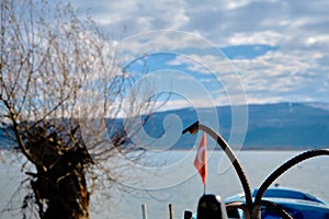 Anchors on the small and blue boats with lake of uluabat