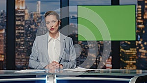 Anchorwoman broadcasting greenscreen display studio. Presenter ending broadcast