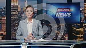 Anchorwoman ending tv news evening program closeup. Presenter going from studio