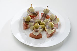 Anchovies, stuffed olives, artichokes and tomatoes