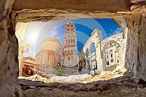 Ancien old Roman queen Jelena square and cathedral in Split view through stone window