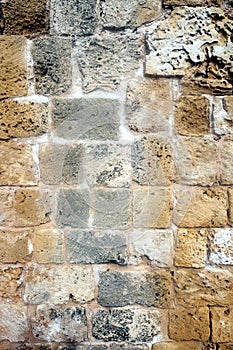 Ancien wall from brown stones front view
