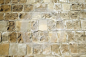 Ancien wall from limestone as background front view closeup