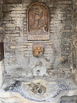 Ancient 13th century fountain outside the Chiesa Nuova in Assisi, Italy.