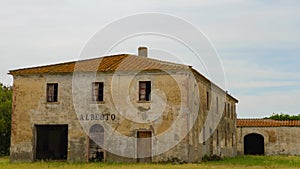 Ancient abandoned farmhouse in the Tuscan countryside near Bolgheri, Italy.