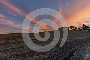 Ancient abandoned stone farmhouse at sunset, Sienese countryside, Tuscany, Italy