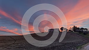 Ancient abandoned stone farmhouse at sunset, Sienese countryside, Tuscany, Italy