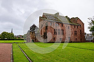 Ancient Abbots House building at courtyard of Arbroath Abbey in Scotland at cloudy afternoon