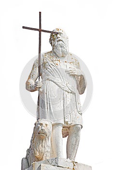 Ancient aged sculpture of poor stranger pilgrim with cross and sitting lion at roof of Santa Maria Assunta Jesuits Church in