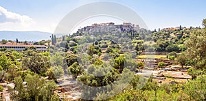 Ancient Agora in Athens, Greece. Panoramic view of Greek ruins and Acropolis in distance