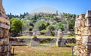 Ancient Agora in summer, Athens, Greece. It is famous tourist attraction of Athens. Panorama of Agora with classical Greek ruins