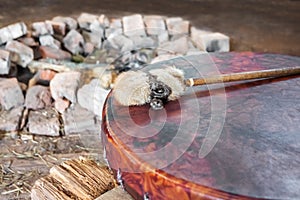 Ancient amerindian tambourine and drum drumstick replica photo