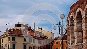 Ancient Amphitheater Arena, Ancient Buildings and Lantern in Verona photo